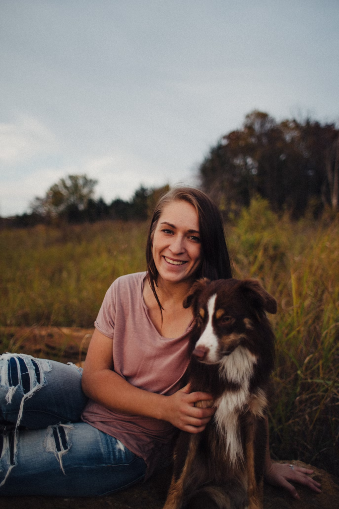 A-lady-with-her-puppy-sitting-in-jungle