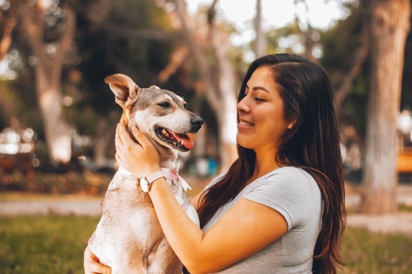 Woman holding her dog